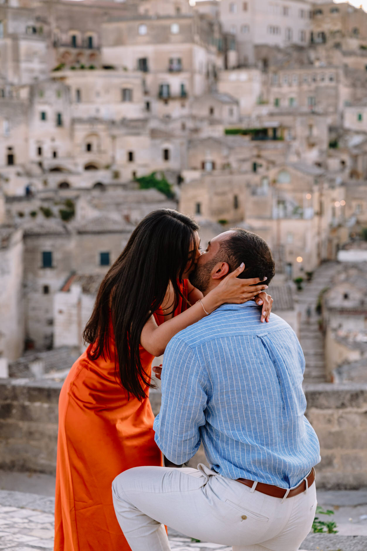 engaged couple kissing in matera