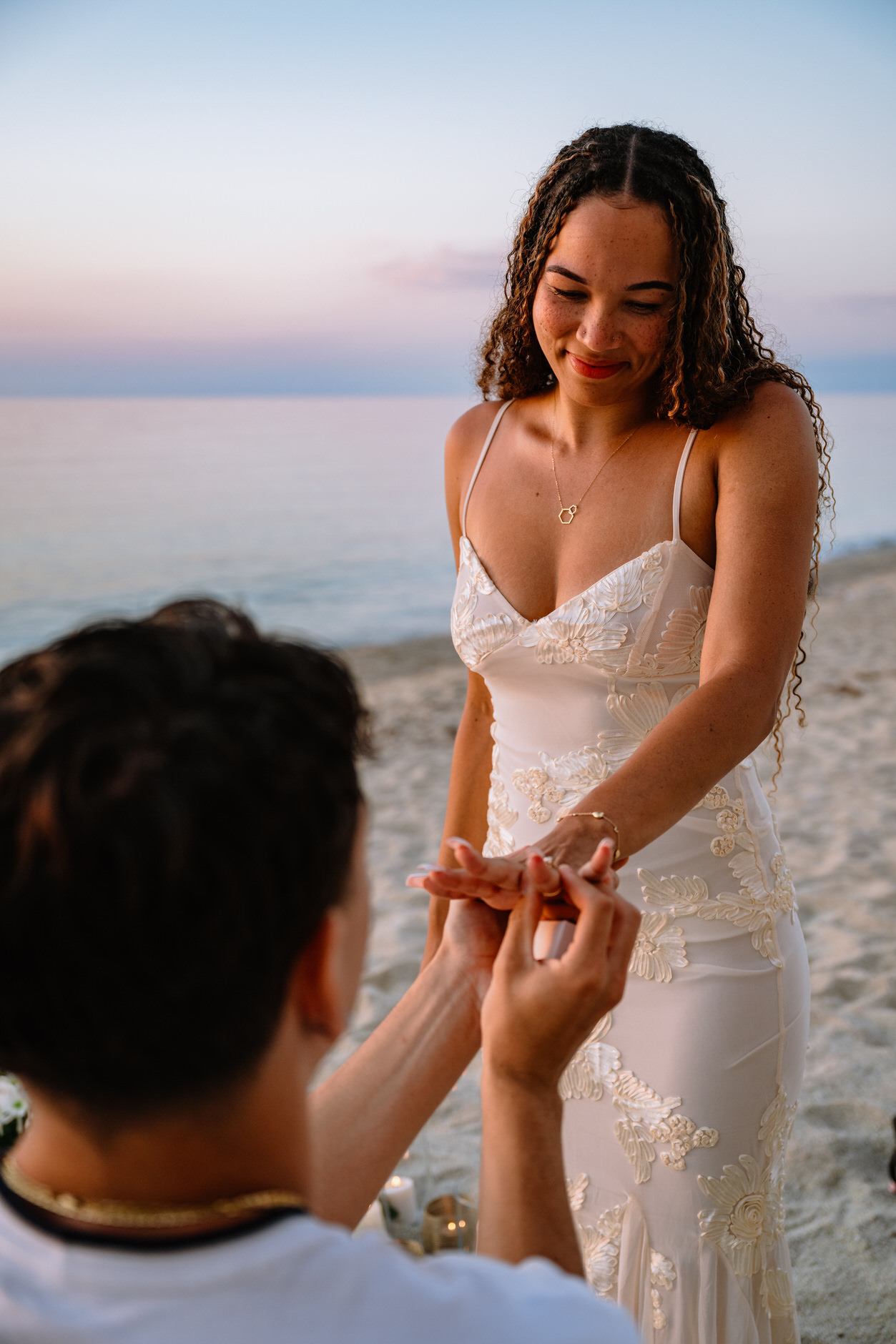 Intimate moment between a couple right after saying yes on a beach in Tropea