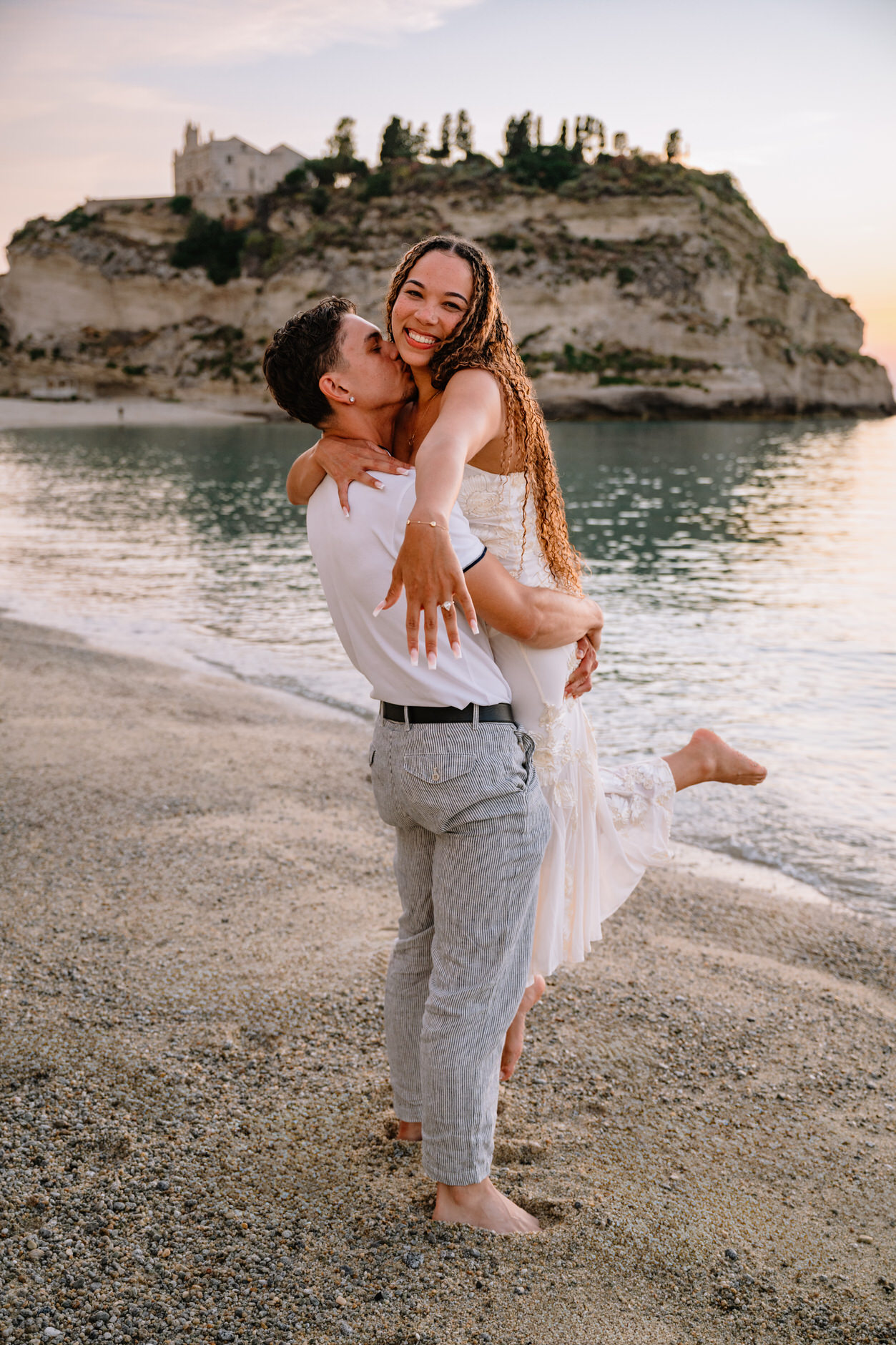 Sunset reflection on the sea during a surprise engagement proposal in Calabria